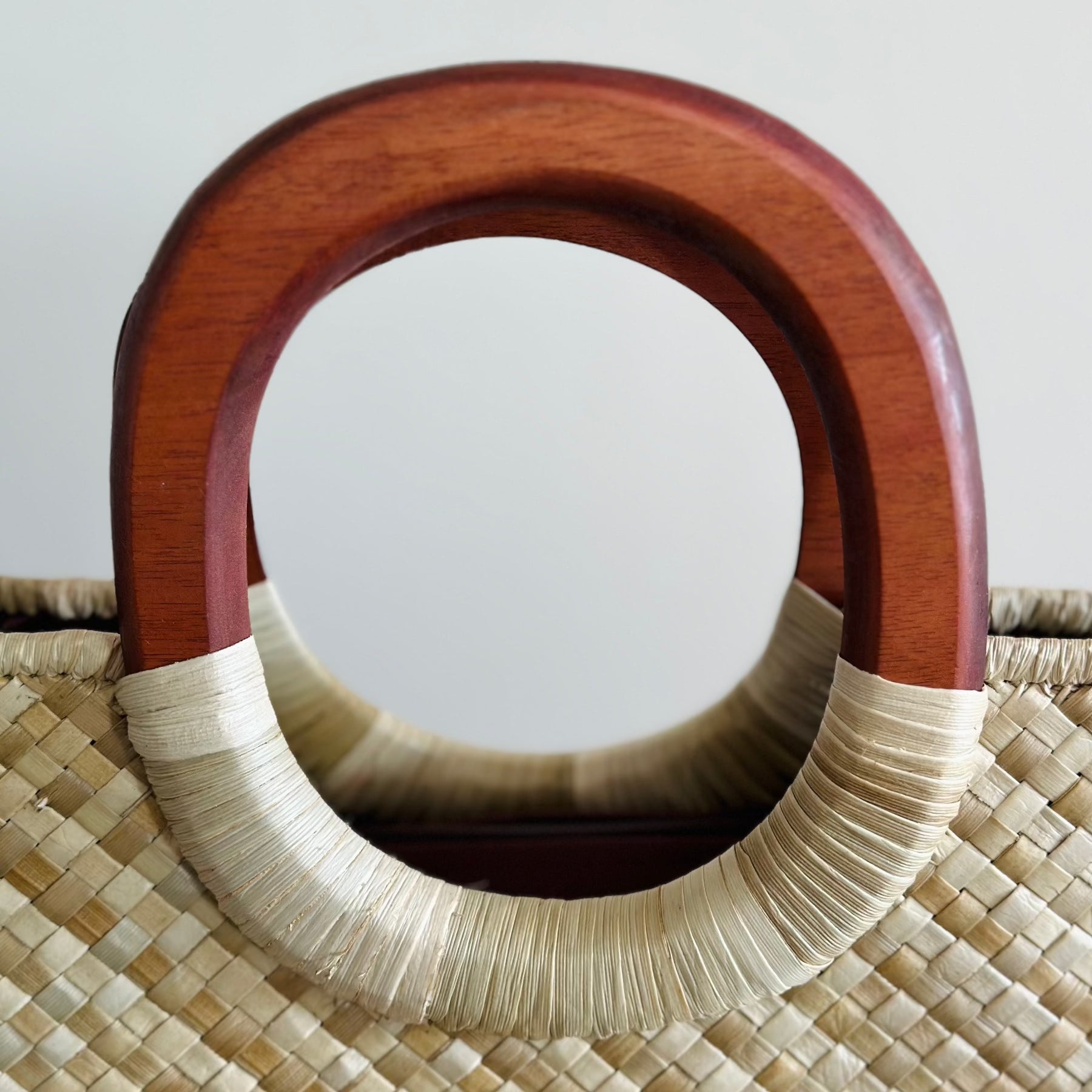 Close up of wooden handles - Nu'uanu Natural Luxe Lauhala Tote Bag