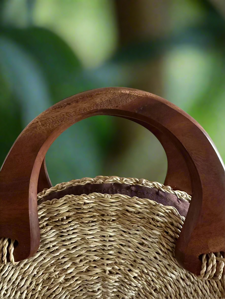Heʻeia Seagrass Round Handbag - closeup of handles