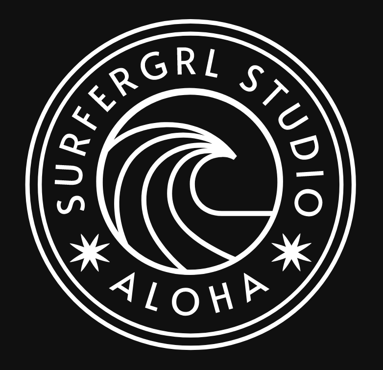 surfergrl studio logo - white circles with wave in middle over black background